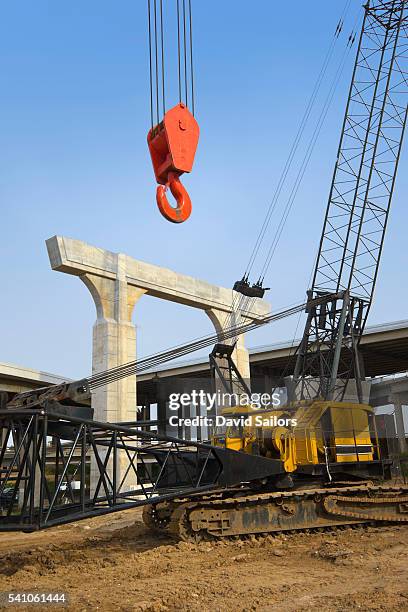 katy freeway construction site in texas - crane hook stock-fotos und bilder