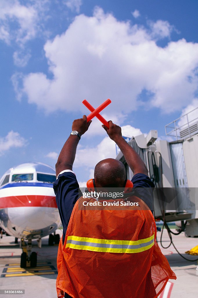 Ground Crew Guiding Plane