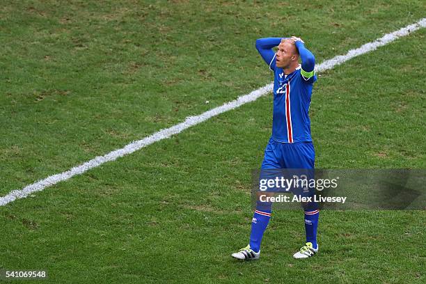 Eidur Gudjohnsen of Iceland looks dejected after the full time whistle during the UEFA EURO 2016 Group F match between Iceland and Hungary at Stade...