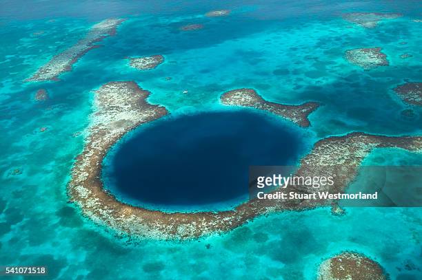 blue hole on lighthouse atoll - atoll stock pictures, royalty-free photos & images