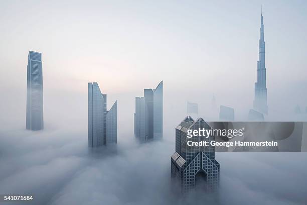 skyscrapers in fog, dubai, united arab emirates - dubai fog stock pictures, royalty-free photos & images