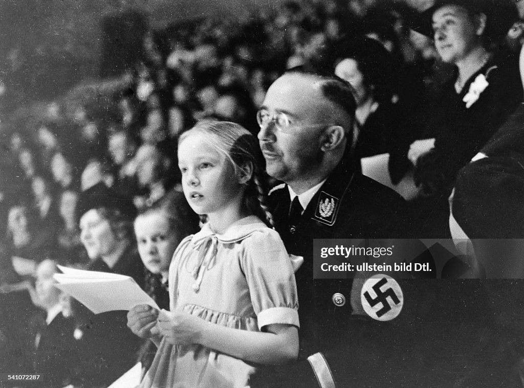 HEINRICH HIMMLER (1900-1945). German Reichsf³hrer-SS and Gestapo chief. Himmler and his daughter at a sports event at Berlin, Germany, March 1938.