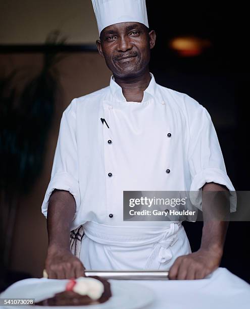 chef with cake on plate - push cake stock pictures, royalty-free photos & images