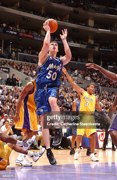 Mike Miller of the Orlando Magic shoots a basket during the second half of action against the Los Angeles Lakes at the Staples Center in Los Angeles,...