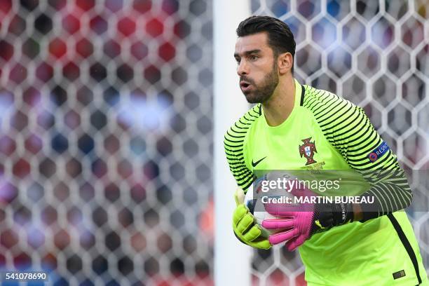 Portugal's goalkeeper Rui Patricio saves a ball during the Euro 2016 group F football match between Portugal and Austria at the Parc des Princes in...