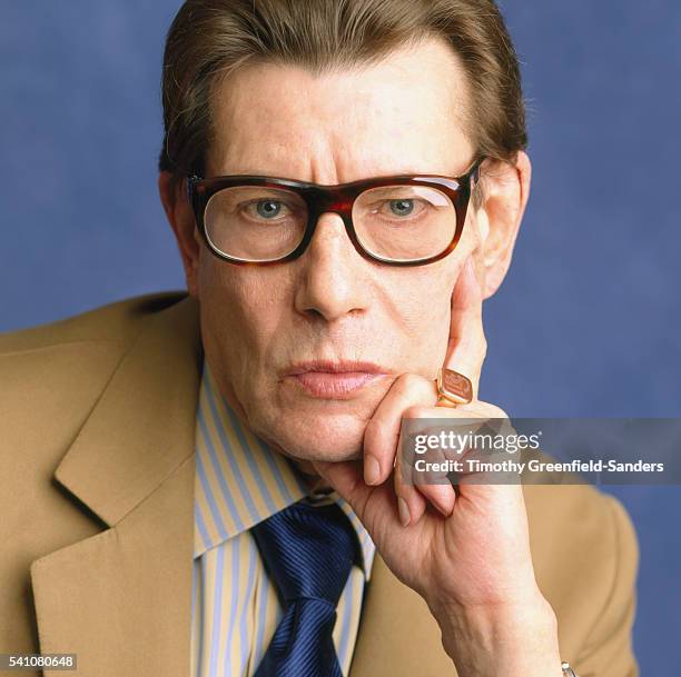 Fashion designer Yves Saint Laurent poses for a portrait in 1999 in New York City.