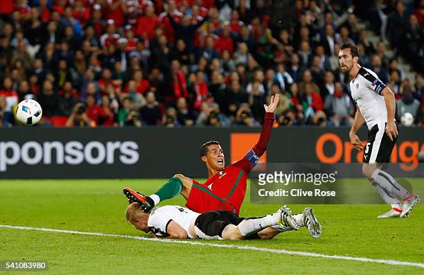 Martin Hinteregger of Austria fouls Cristiano Ronaldo of Portugal to give away a panelty during the UEFA EURO 2016 Group F match between Portugal and...