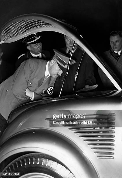 Hitler, Adolf - Politician, NSDAP, Germany*20.04.1889-+ - visiting the motor show in Berlin; in the background his personal adjutant SS-Fuehrer...