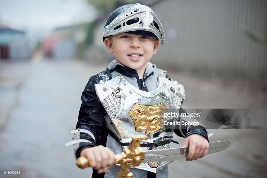 Portrait of boy (7-9) wearing knight costume