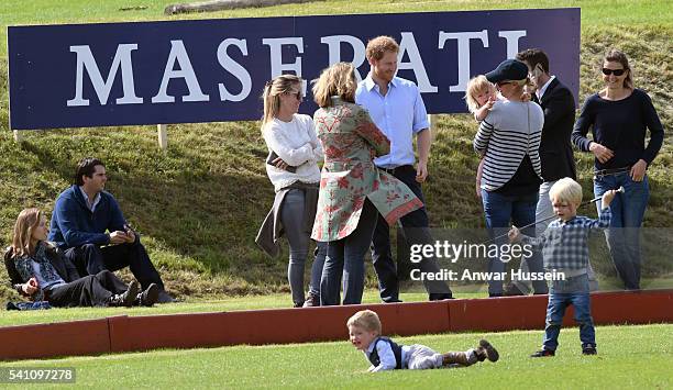 Prince Harry chats to Zara Tindall and Mia Tindall during the Maserati Charity Polo match at the Gloucestershire Festival of Polo at the Beaufort...