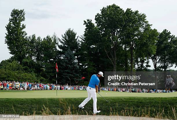 Dustin Johnson of the United States hits a pitch shot behind the second green during the third round of the U.S. Open at Oakmont Country Club on June...