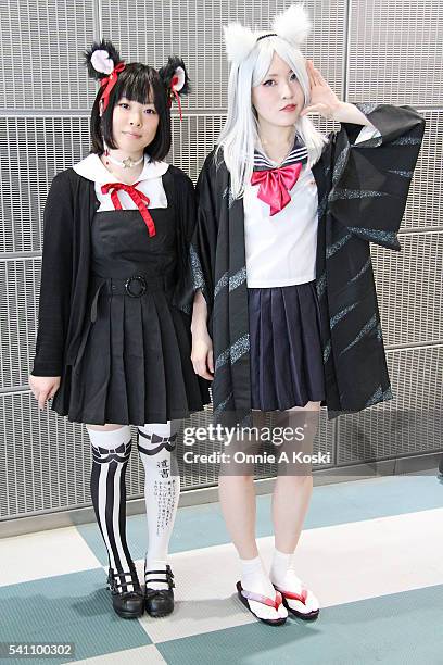Takei Mitsuki is wearing a Bodyline lolita black dress, Nemutai Company stockings, black mouse ears, sailor fuku schoolgirl uniform, white leather...