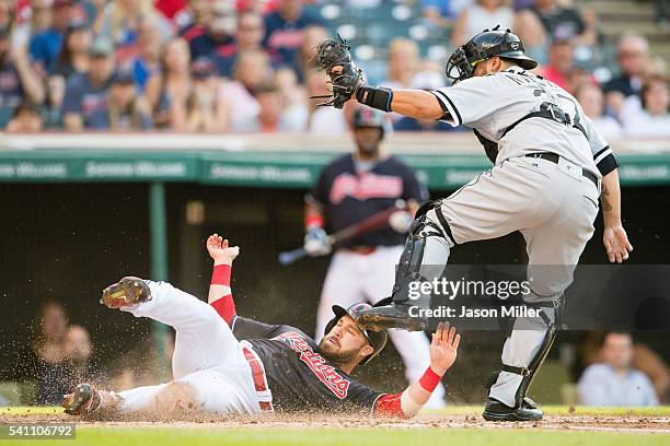 Jason Kipnis of the Cleveland Indians is out at home on the tag from catcher Dioner Navarro of the Chicago White Sox during the second inning at...