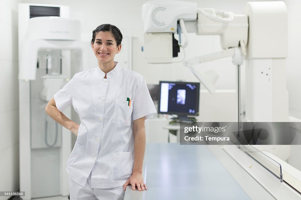 Nurse Using Camera Young Nurse Looking At Camera And Posing In A Hospital High-Res Stock ...