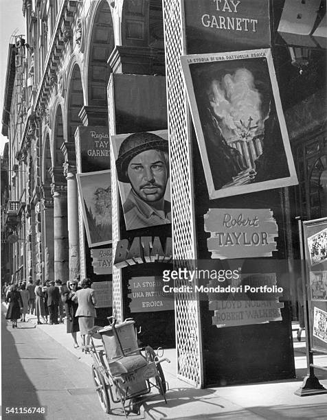 Movie posters outside Cinema Odeon in Milan. Milan, 1950s