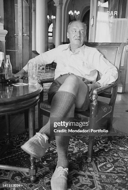 Russian-American writer Vladimir Nabokov sitting in a room of Montreux Palace Hotel, where he is staying. Montreux , 1973