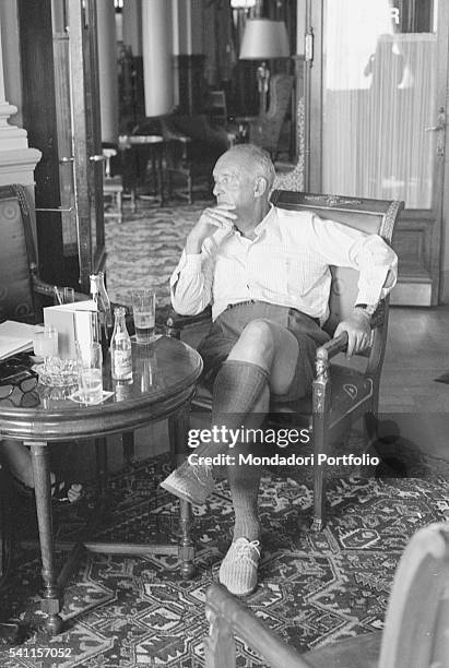 Russian-American writer Vladimir Nabokov having a conversation sitting in a room of Montreux Palace Hotel, where he is staying. Montreux , 1973