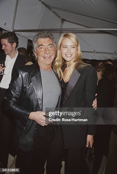 Italian fashion designer Roberto Cavalli and Argentine model Valeria Mazza attend the Iceberg opening celebration to benefit Love Heals, USA, circa...