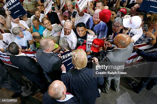Republican presidential candidate Donald Trump greets supporters following a campaign rally on June 18, 2016 in Phoenix, Arizona. Trump returned to...