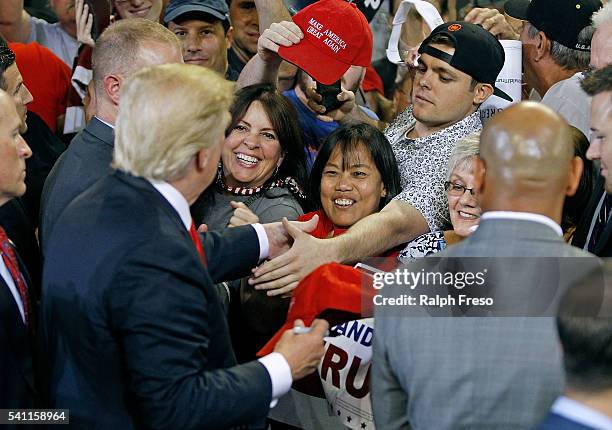 Republican presidential candidate Donald Trump greets supporters following a campaign rally on June 18, 2016 in Phoenix, Arizona. Trump returned to...