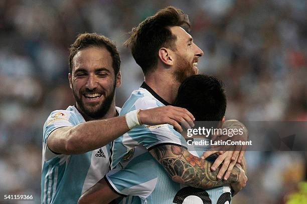 Lionel Messi celebrates with teammates Gonzalo Higuain and Nicolas Gaitan after scoring the third goal of the game during a Quarterfinal match...