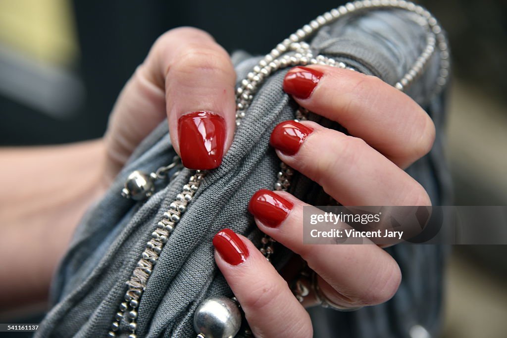 Woman with red nail polish