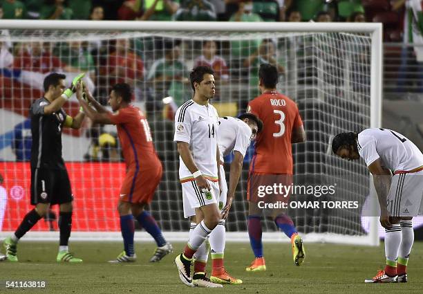 Chilean players celebrate as Mexican players react in dejection after the Copa America Centenario quarterfinal football match in Santa Clara,...