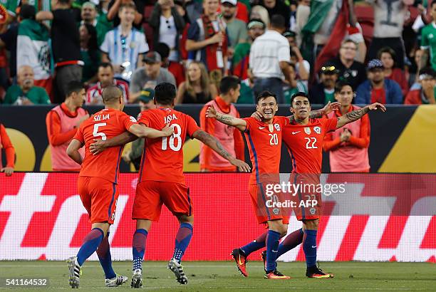 Chilean players celebrate after a Copa America Centenario quarterfinal football match against Mexico in Santa Clara, California, United States, on...