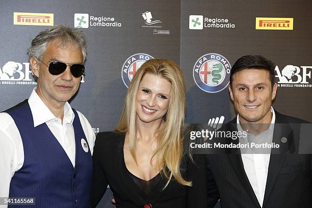 Italian singer Andrea Bocelli, Swiss-born Italian TV host Michelle Hunziker and Argentinian team manager and former player Javier Zanetti posing...