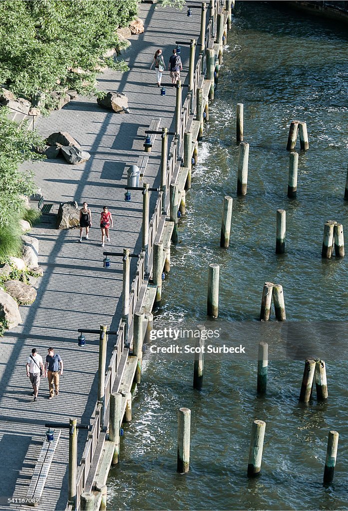 Couples walking next to piers