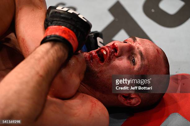 Rory MacDonald of Canada is take down by Stephen Thompson of the United States in their welterweight bout during the UFC Fight Night event inside the...