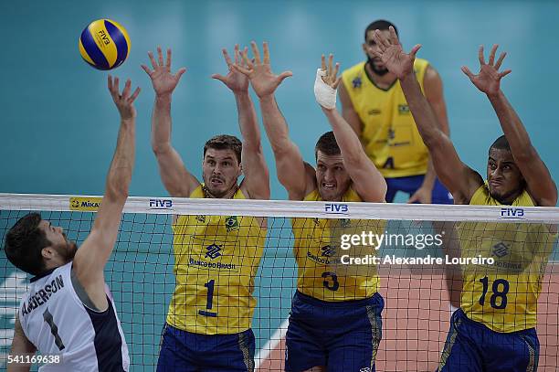 Bruno Rezende, Eder and Lucarelli of Brazil attempts to block as Matthew Anderson of USA spikes the ball during the match between Brasil and USA on...