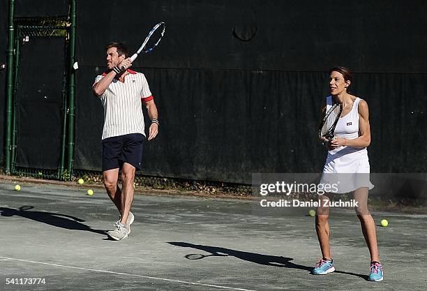 Marion Bartoli and Mark Tevis play tennis during The Daily Summer's celebration of Marion Bartoli's new LOVE FILA collection at Hampton Racquet on...