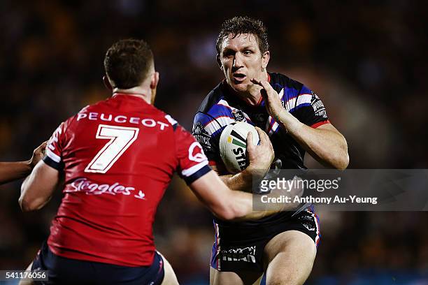 Ryan Hoffman of the Warriors makes a run at Jackson Hastings of the Roosters during the round 15 NRL match between the New Zealand Warriors and the...
