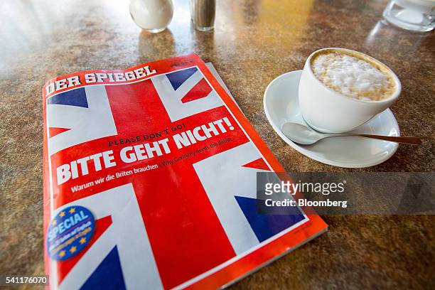 Copy of German magazine Der Spiegel featuring the headline "Please don't go!" and a British Union flag illustration on the cover sits on a table next...