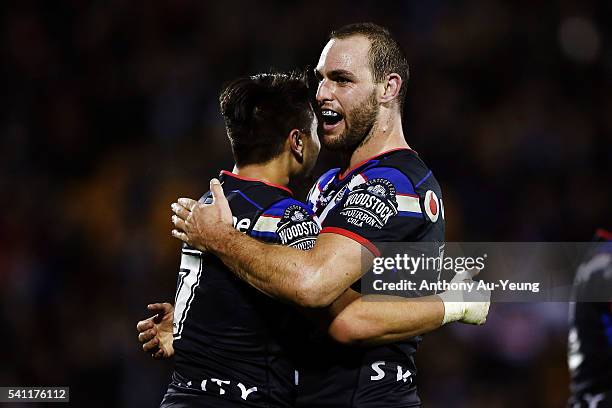 Simon Mannering and Shaun Johnson of the Warriors celebrate after winning the round 15 NRL match between the New Zealand Warriors and the Sydney...