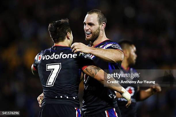 Simon Mannering and Shaun Johnson of the Warriors celebrate after winning the round 15 NRL match between the New Zealand Warriors and the Sydney...