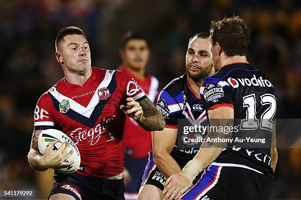 Shaun Kenny-Dowall of the Roosters makes a run at Ryan Hoffman of the Warriors during the round 15 NRL match between the New Zealand Warriors and the...