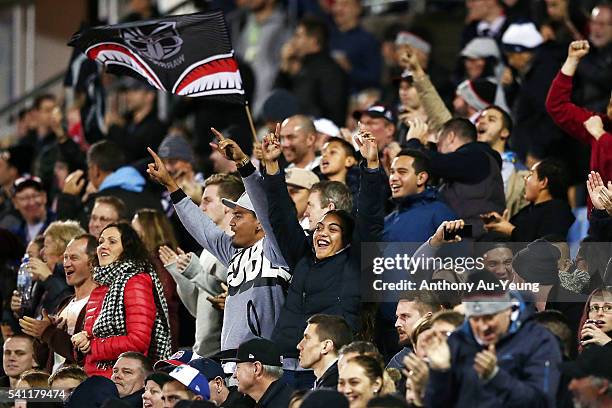 Fans enjoying the action during the round 15 NRL match between the New Zealand Warriors and the Sydney Roosters at Mt Smart Stadium on June 19, 2016...