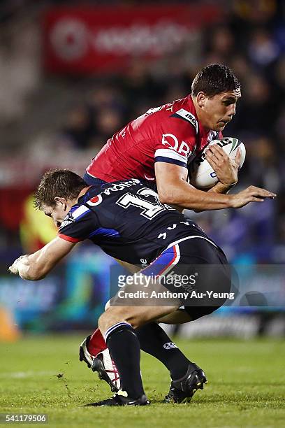 Christopher Smith of the Roosters is tackled by Ryan Hoffman of the Warriors during the round 15 NRL match between the New Zealand Warriors and the...