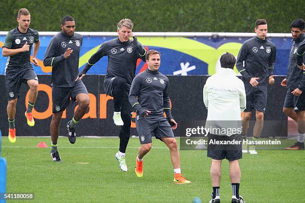 Joachim Loew , head coach of the German national team watches his players Joshua Kimmich, Jonathan Tah, Bastian Schweinsteiger, Mario Goetze, Julian...