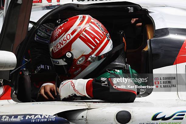 Kazuki Nakajima of Toyota Gazoo Racing reacts in his car after suffering engine problems while leading at the end of the Le Mans 24 Hour race handing...