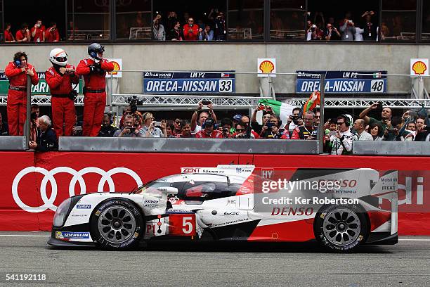 Race leader Kazuki Nakajima of Toyota Gazoo Racing suffers engine problems on the main straight at the end of the Le Mans 24 Hour race handing...