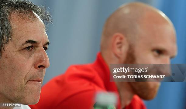 Austria's coach Marcel Koller and goalkeeper Robert Almer are pictured during a press conference at their training ground in Mallemort, southern...