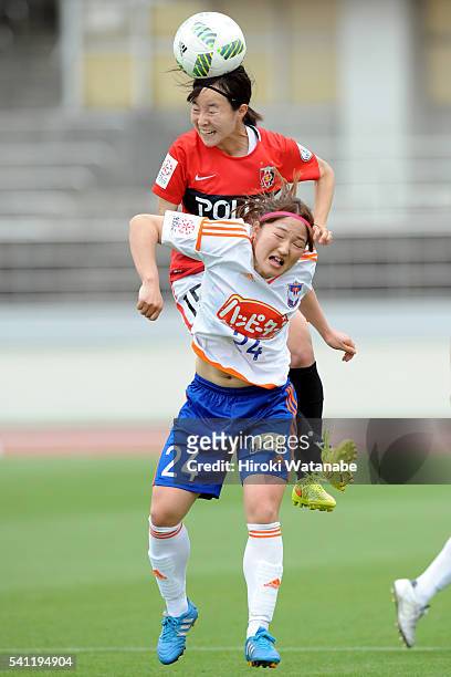 Hikaru Kitagawa of Urawa Reds and Aya Saeki of Albirex Niigata compete for the ball during the Nadeshiko League Cup Group B match between Urawa Red...