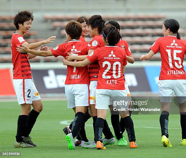 Risa Ikadai of Urawa Reds celebrates scoring the opening goal with her team mates during the Nadeshiko League Cup Group B match between Urawa Red...