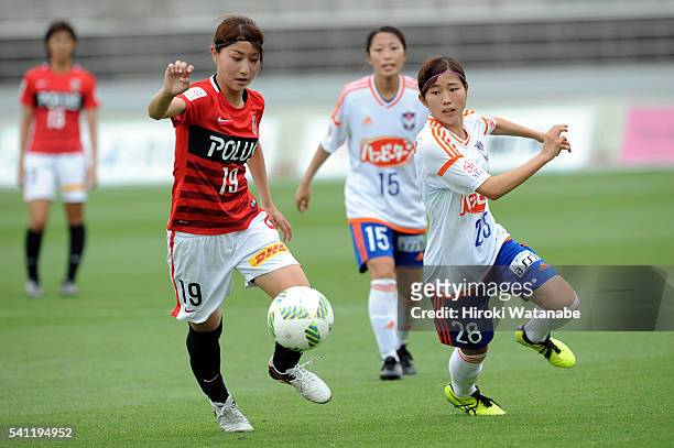 Yuzuho Shiokoshi of Urawa Reds and Mei Yasaka of Albirex Niigata compete for the ball during the Nadeshiko League Cup Group B match between Urawa Red...