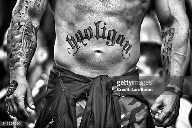 Hungary supporter shows off a tattoo on his torso reading 'Hooligan' during the UEFA EURO 2016 Group F match between Iceland and Hungary at Stade...