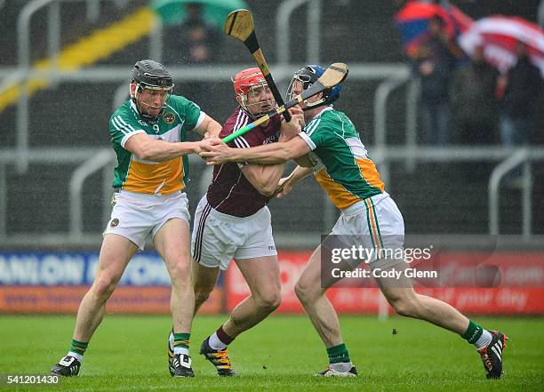 Portlaoise , Ireland - 19 June 2016; Joe Canning of Galway ìn action against Sean Ryan, left, and Chris McDonald of Offaly during the Leinster GAA...