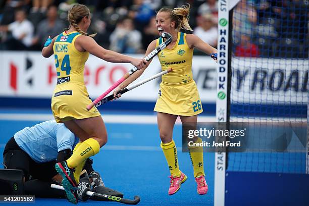 Emily Smith of Australia celebrates with teammate Mariah Williams after she scored the games opening goal during the FIH Women's Hockey Champions...